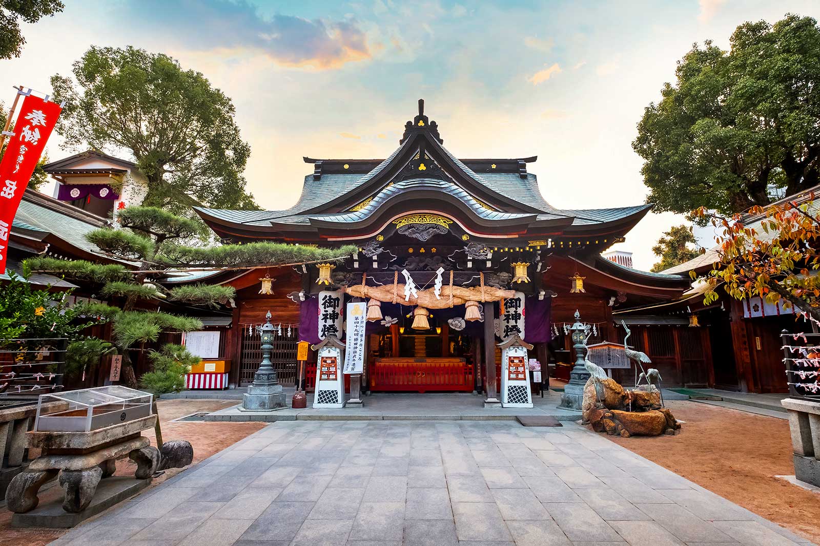 A Japanese shrine surrounded by trees.