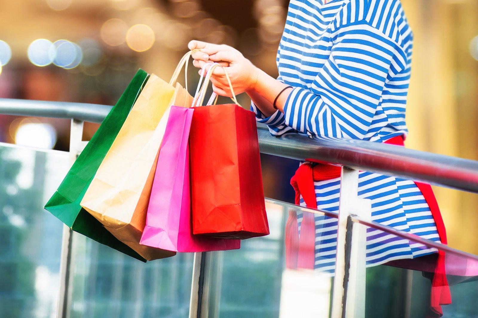 Woman holding shopping bags.