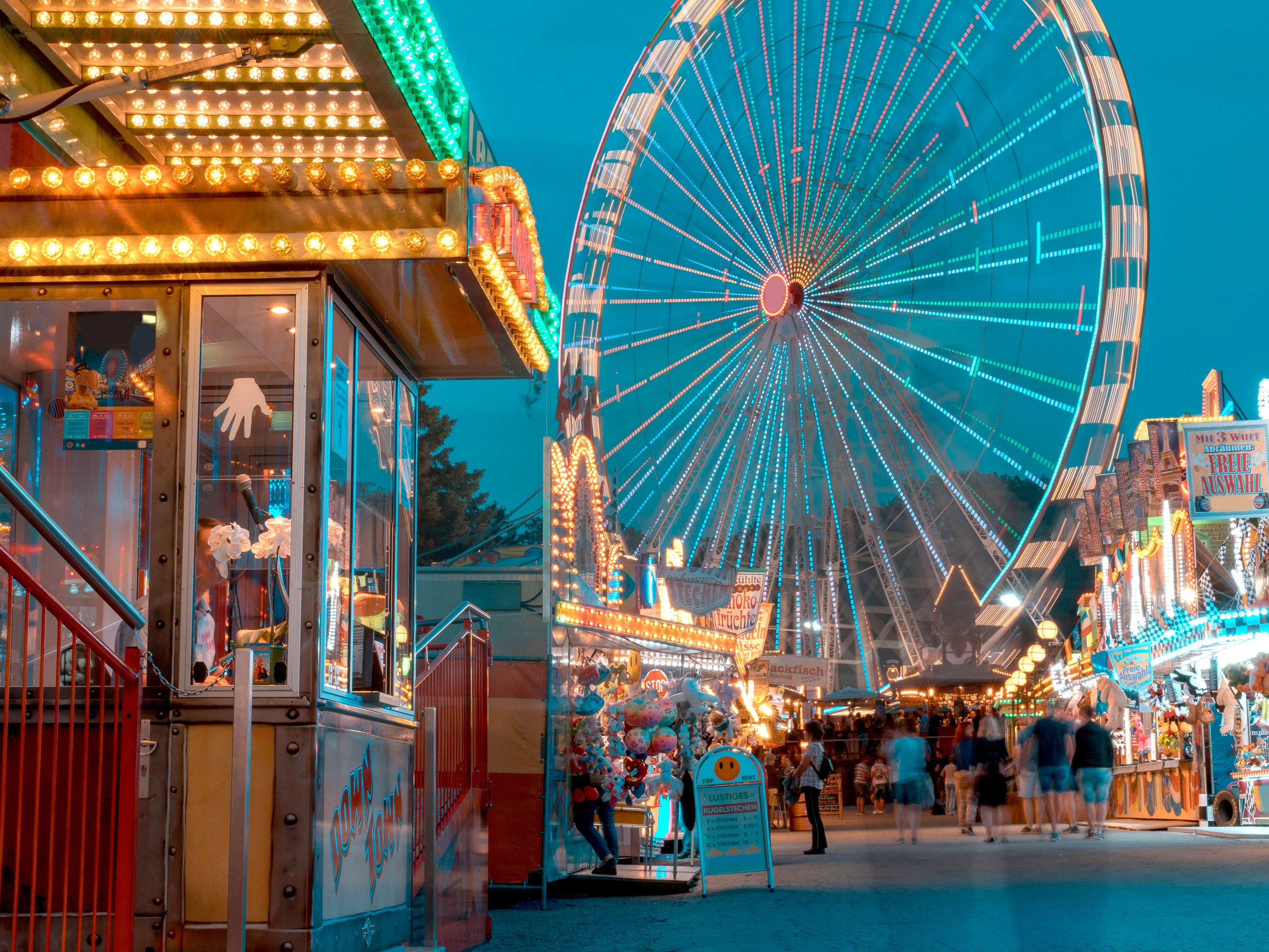 Carnival area with Ferris wheel.