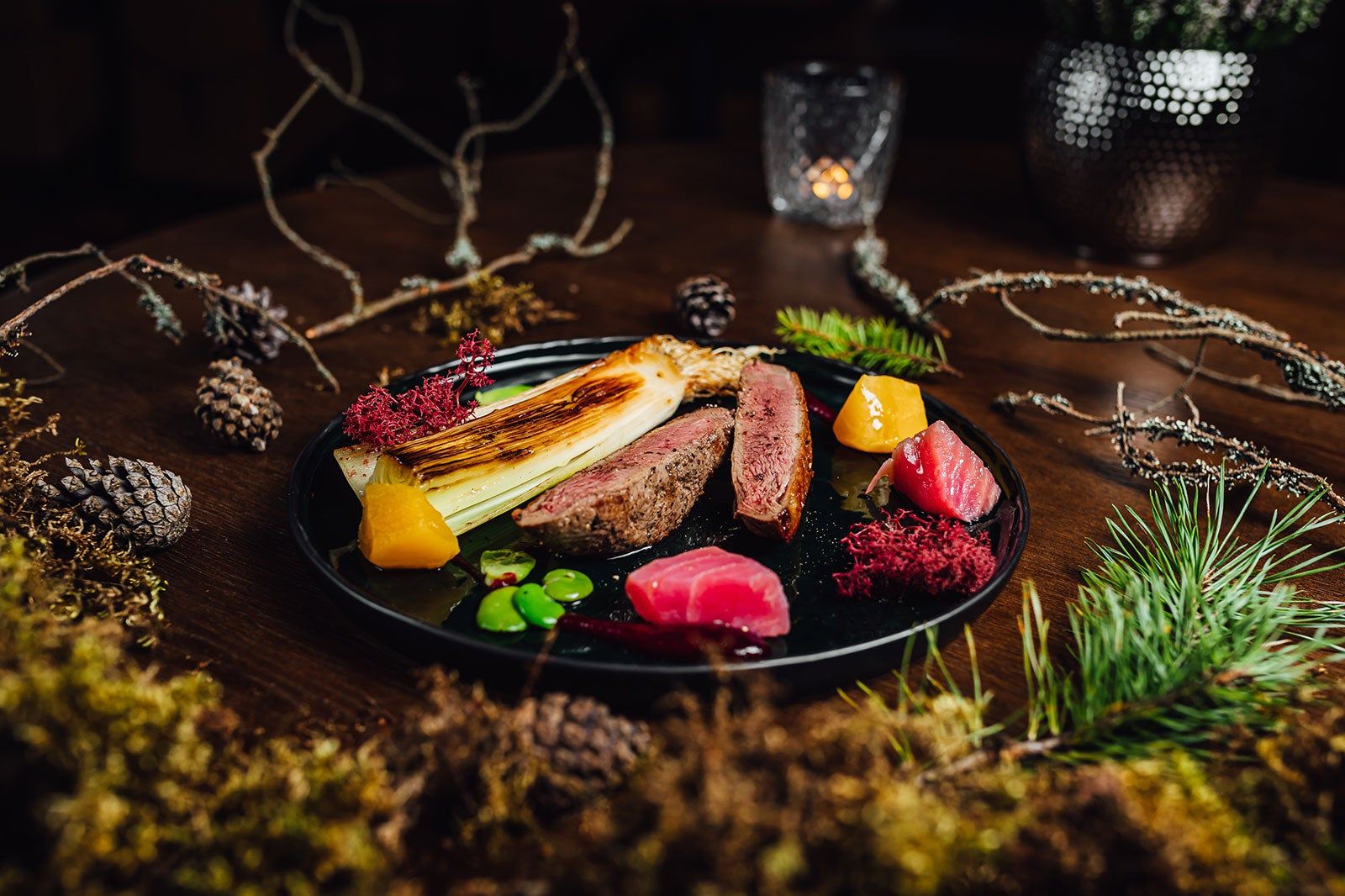 A meal set on a plate surrounded by earthy decorations.