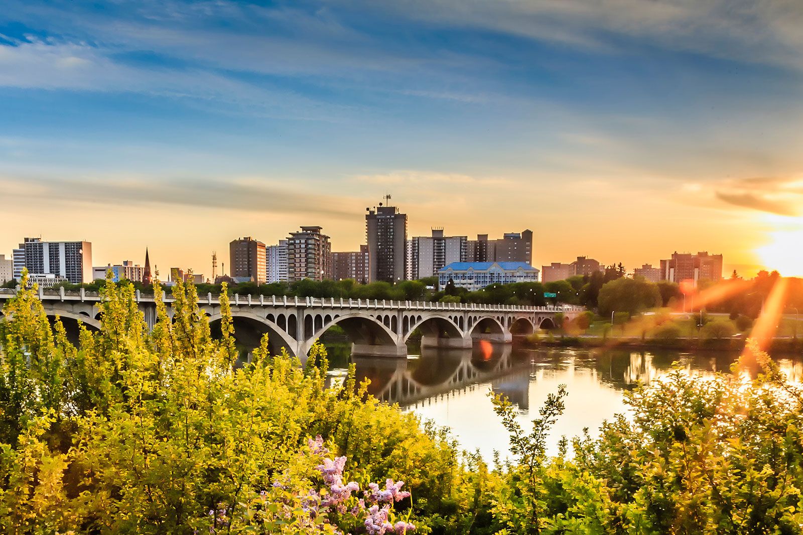 View of river, bridge, and buildings in Saskatoon.