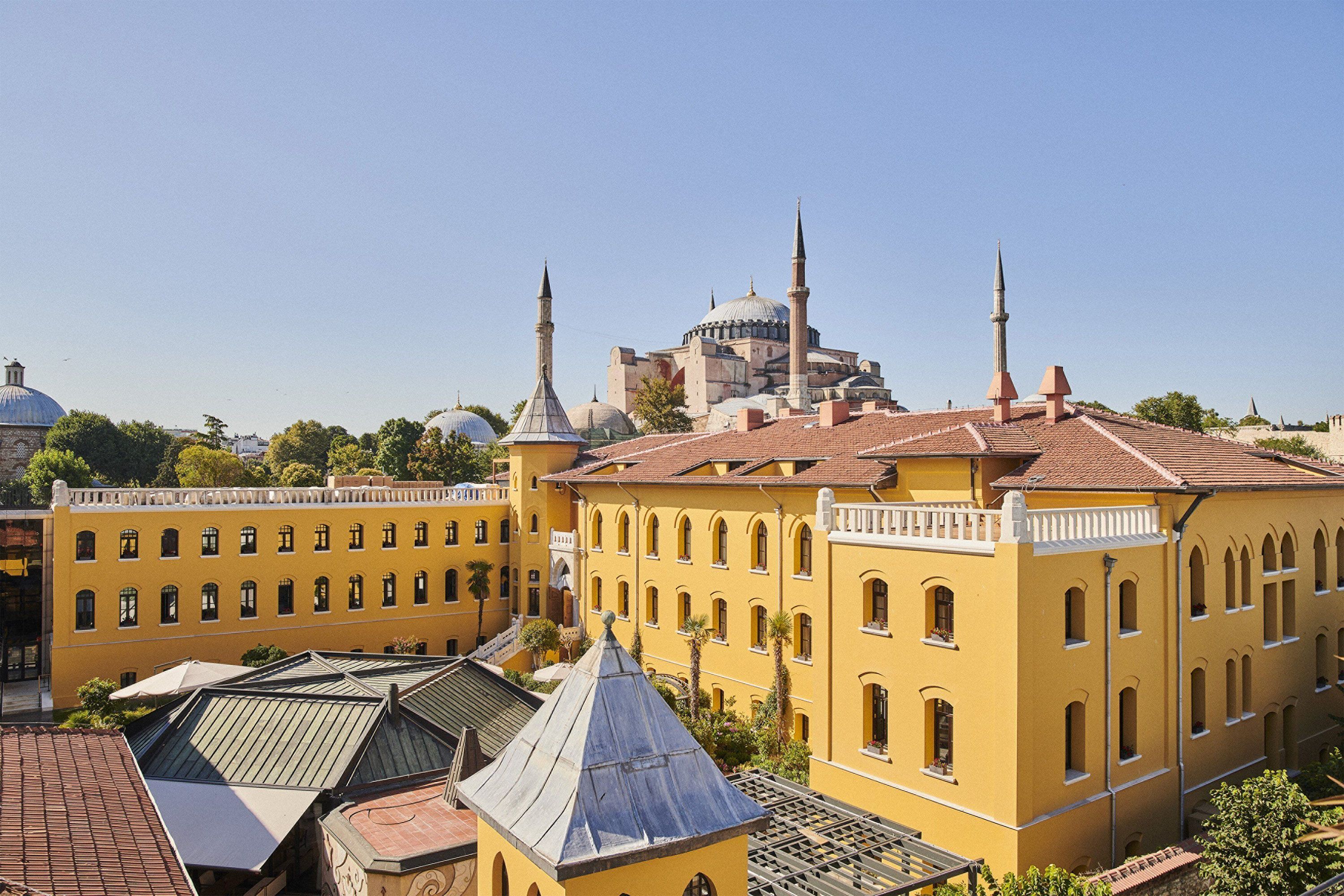 Aerial view of Four Seasons Sultanahmet in Turkey with historic architecture, city surroundings and a view of Hagia Sophia.