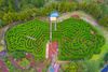An aerial view of a green maze garden.