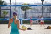 People playing beach volleyball.