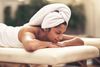 A woman lying on a massage table.