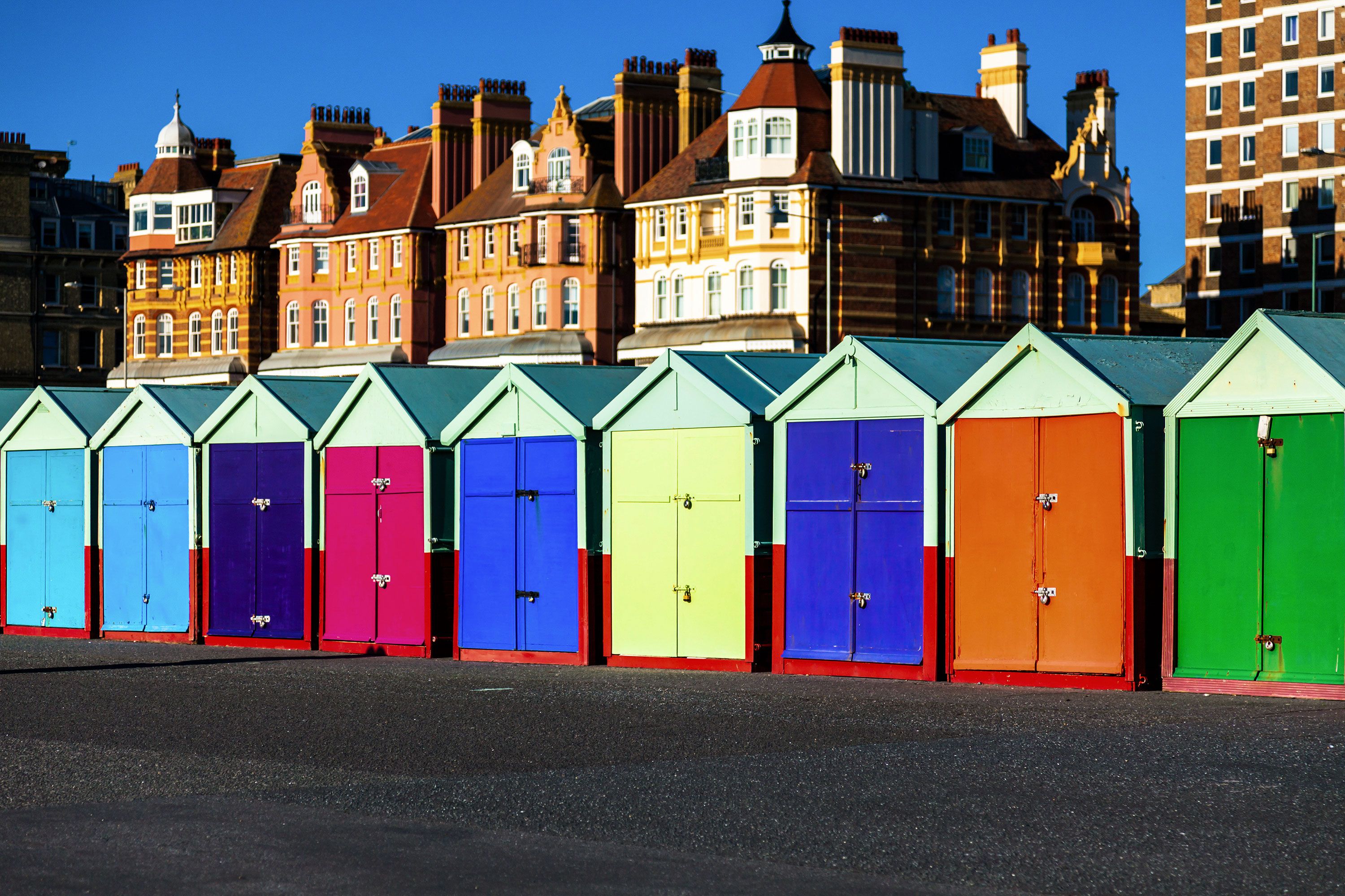 Brightly colored sheds in a row.