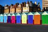 Brightly colored sheds in a row.