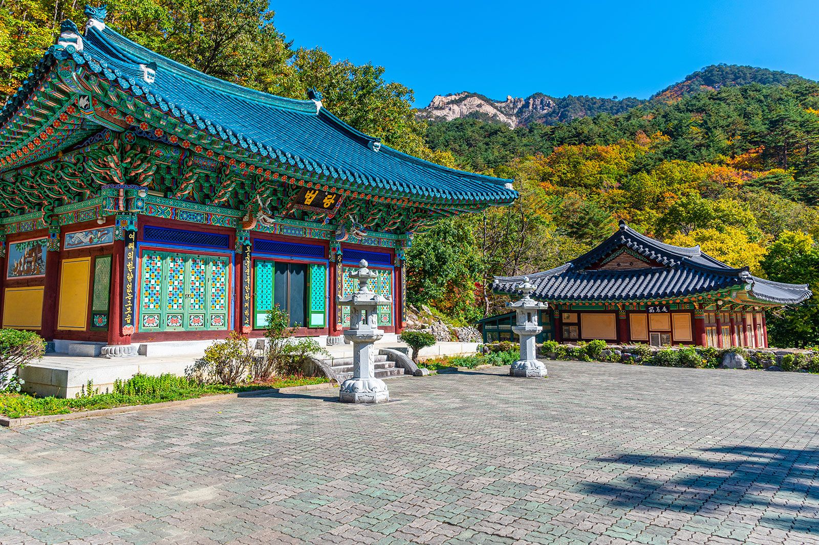 A temple in a national park with rocks and trees.