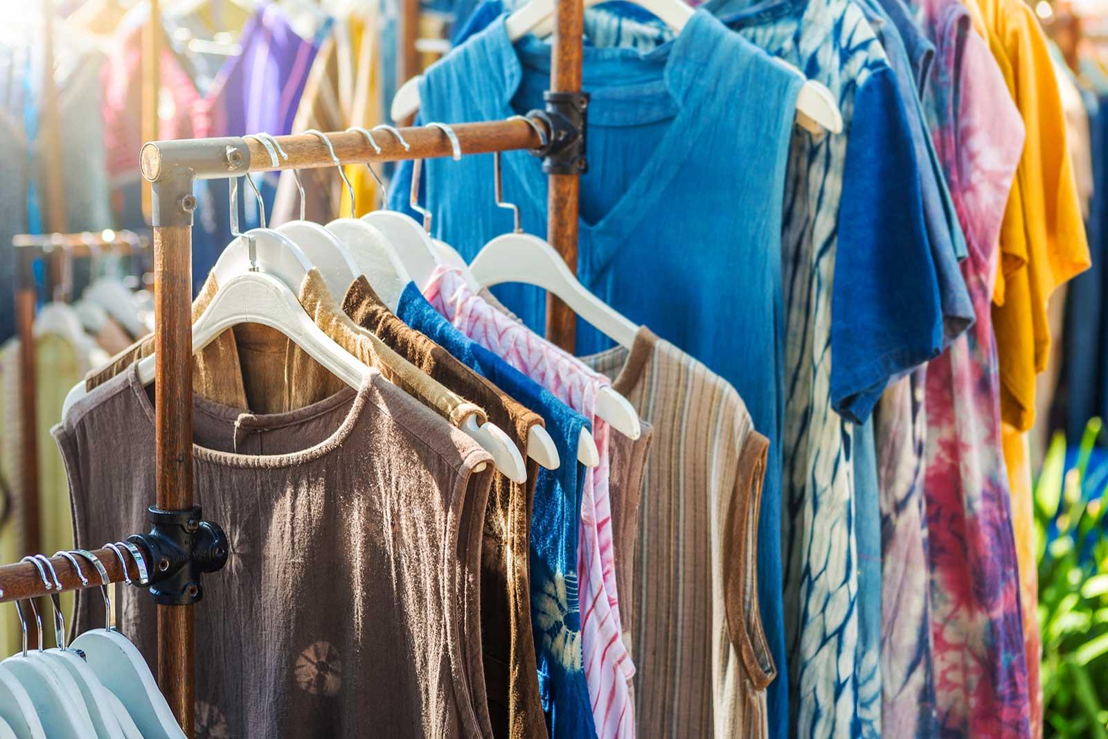Colorful summer clothes on a rack.