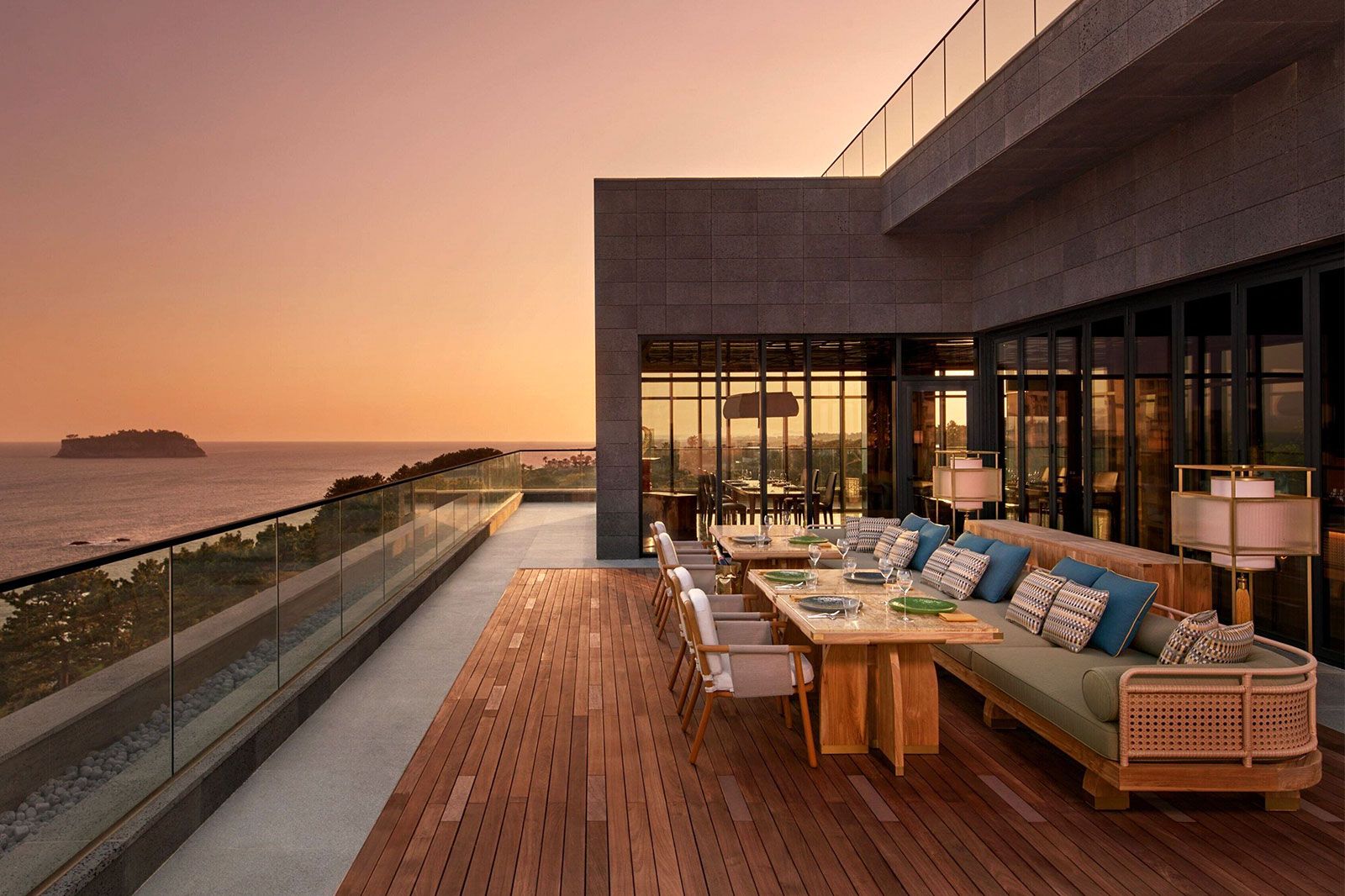 A hotel resort outdoor pool and dining area.