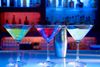 A set of martini glasses with blue background light.