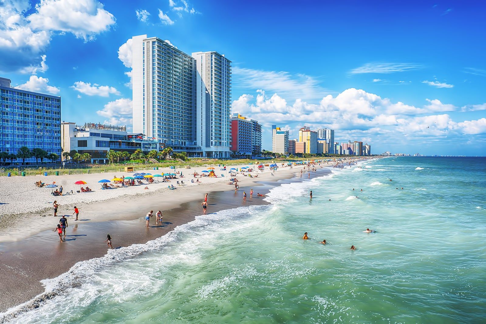 A beach and a city skyline.