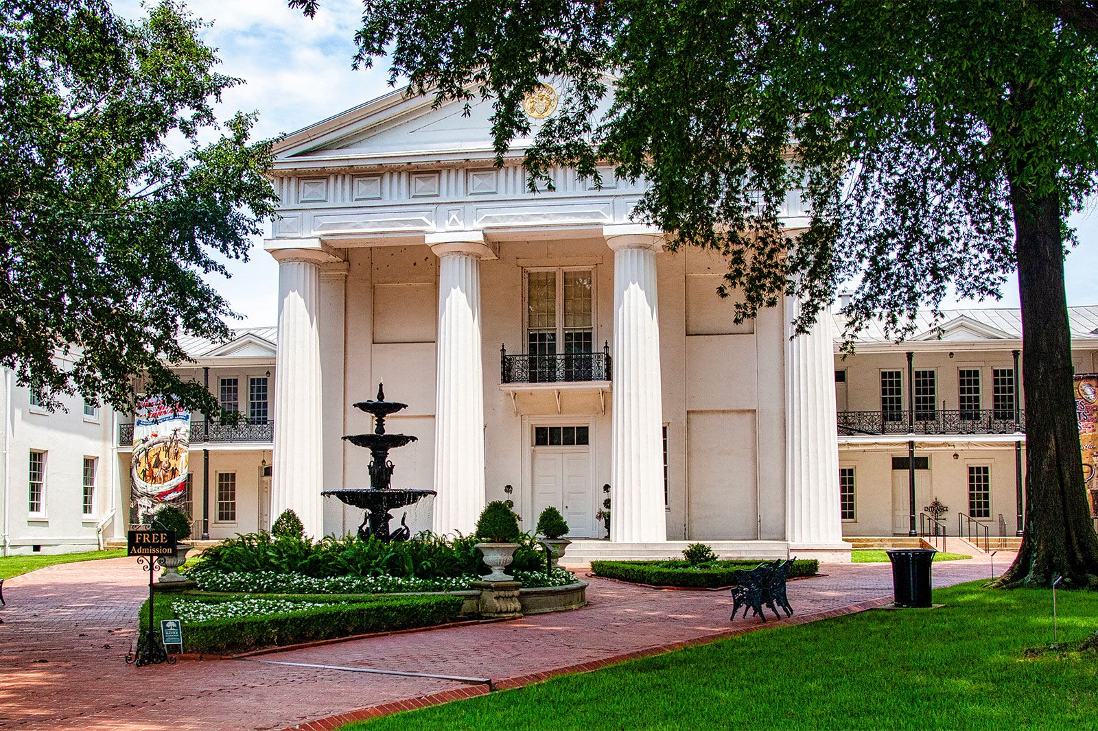 A columned white building.