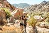 A couple on a desert hiking trail.
