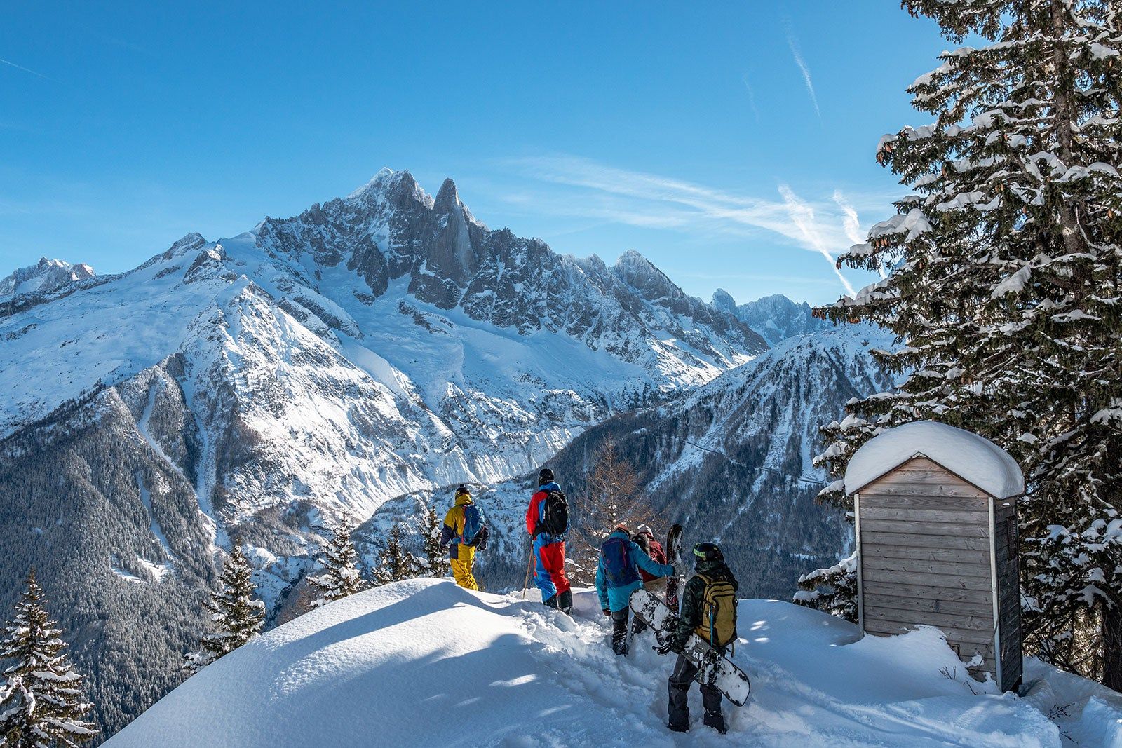 Skiers and snowboarders in the mountains.