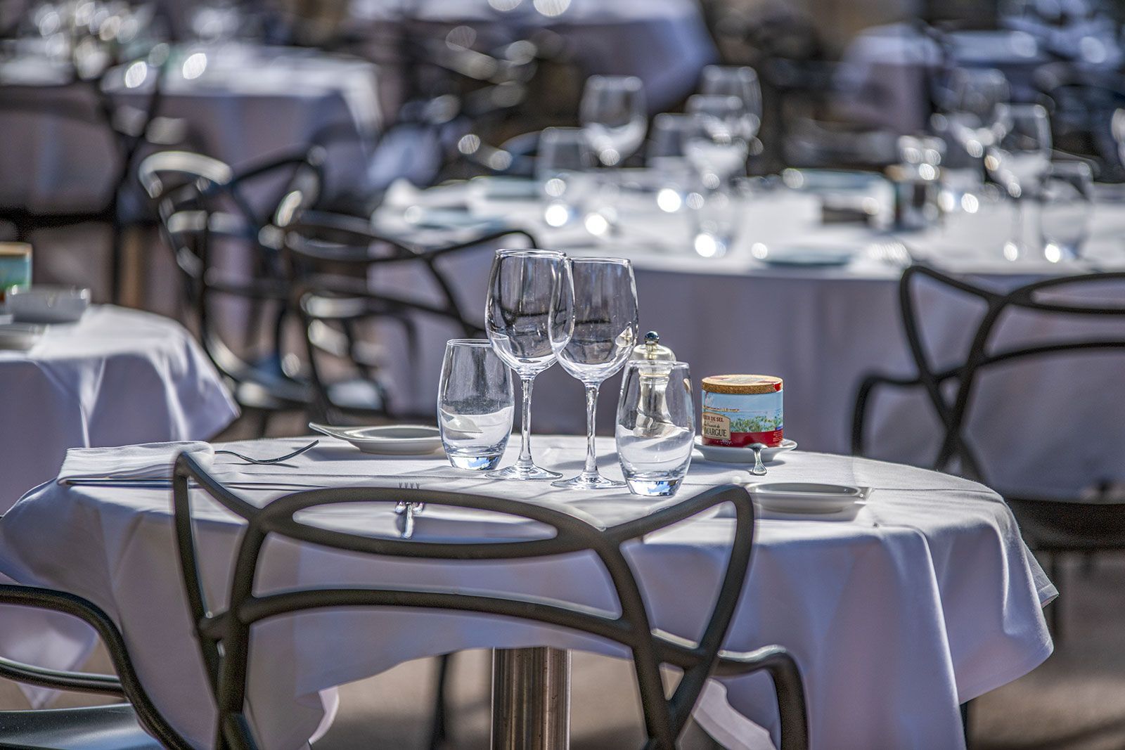Restaurant tables on a terrace.