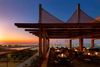 A sunset outdoor eating pavilion at a hotel
