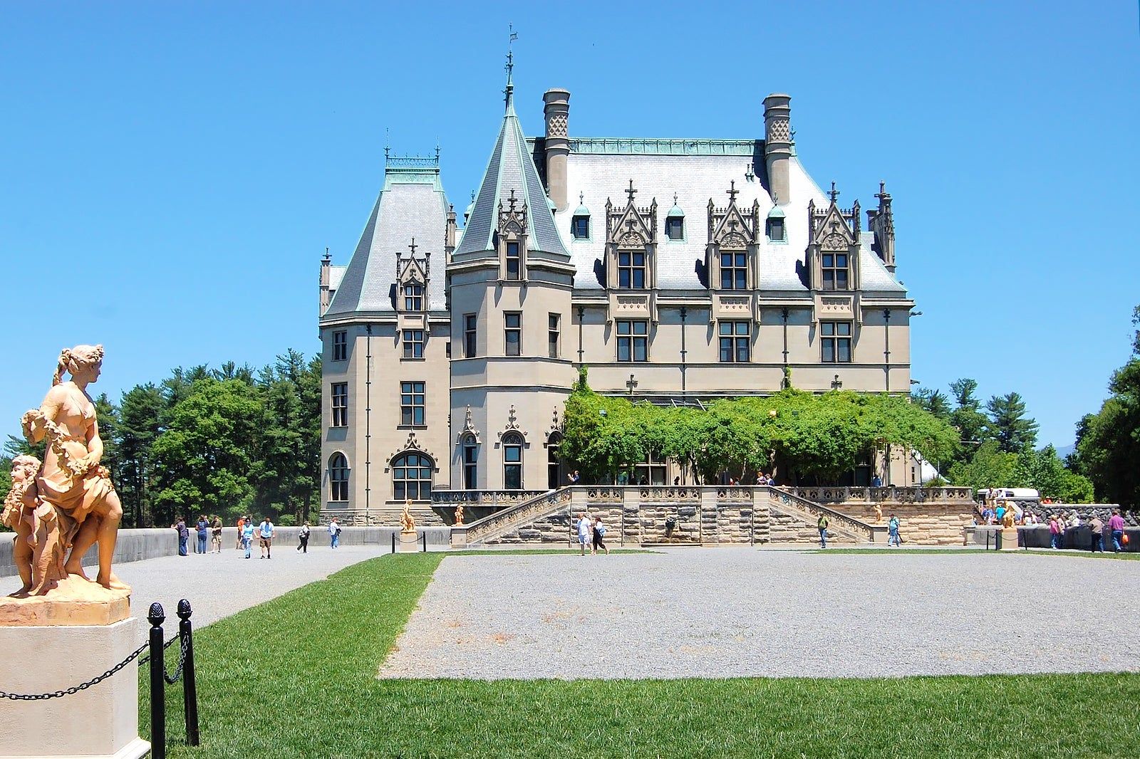 A statue and a grand old building.