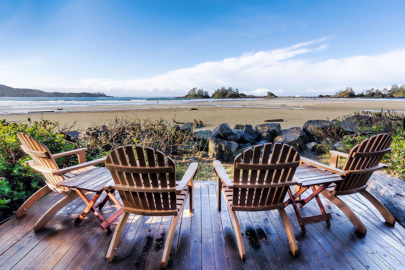 Chairs looking out on the sandy beach.