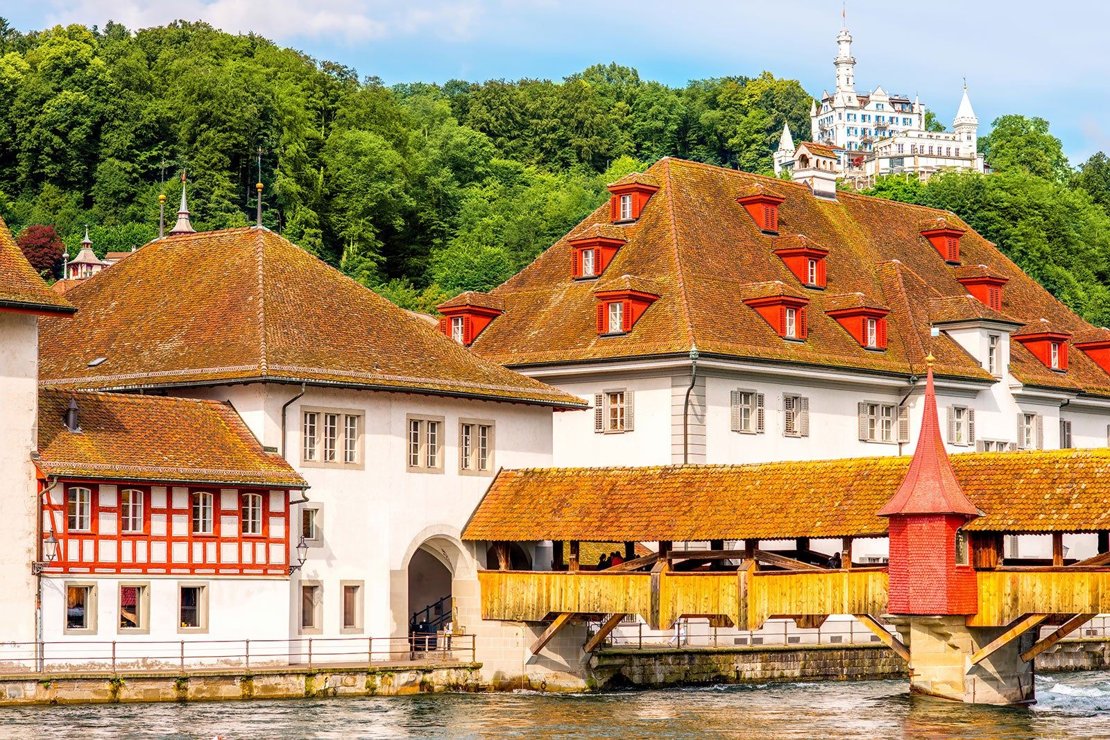 Brown roofed buildings with red trim on the windows.