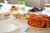 Set table with crab and white wine.