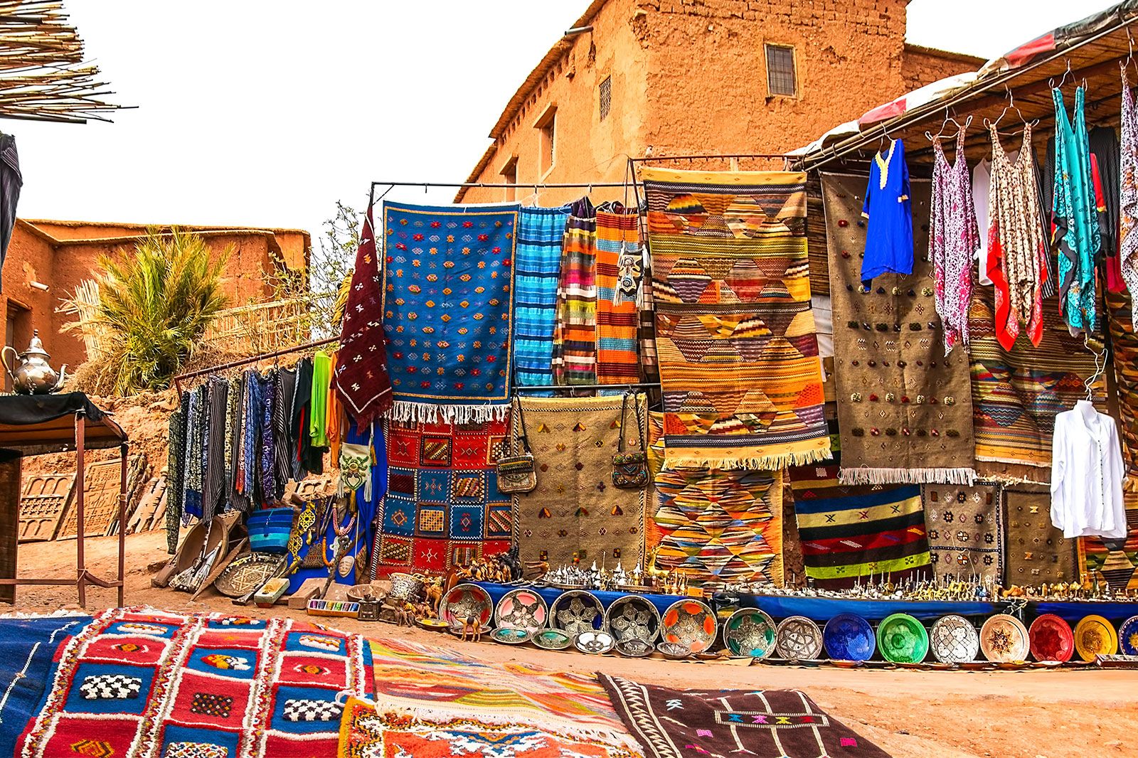 A souvenir shop in an open outdoor market.