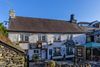 photo by <a href="https://commons.wikimedia.org/wiki/File:Hole_in_t%27Wall_public_house,_Bowness-on-Windermere,_England_02.jpg" target="_blank" rel="noreferrer">Michal Klajban</a> (<a href="https://creativecommons.org/licenses/by-sa/4.0/" target="_blank" rel="noreferrer">CC BY-SA 4.0</a>) modified