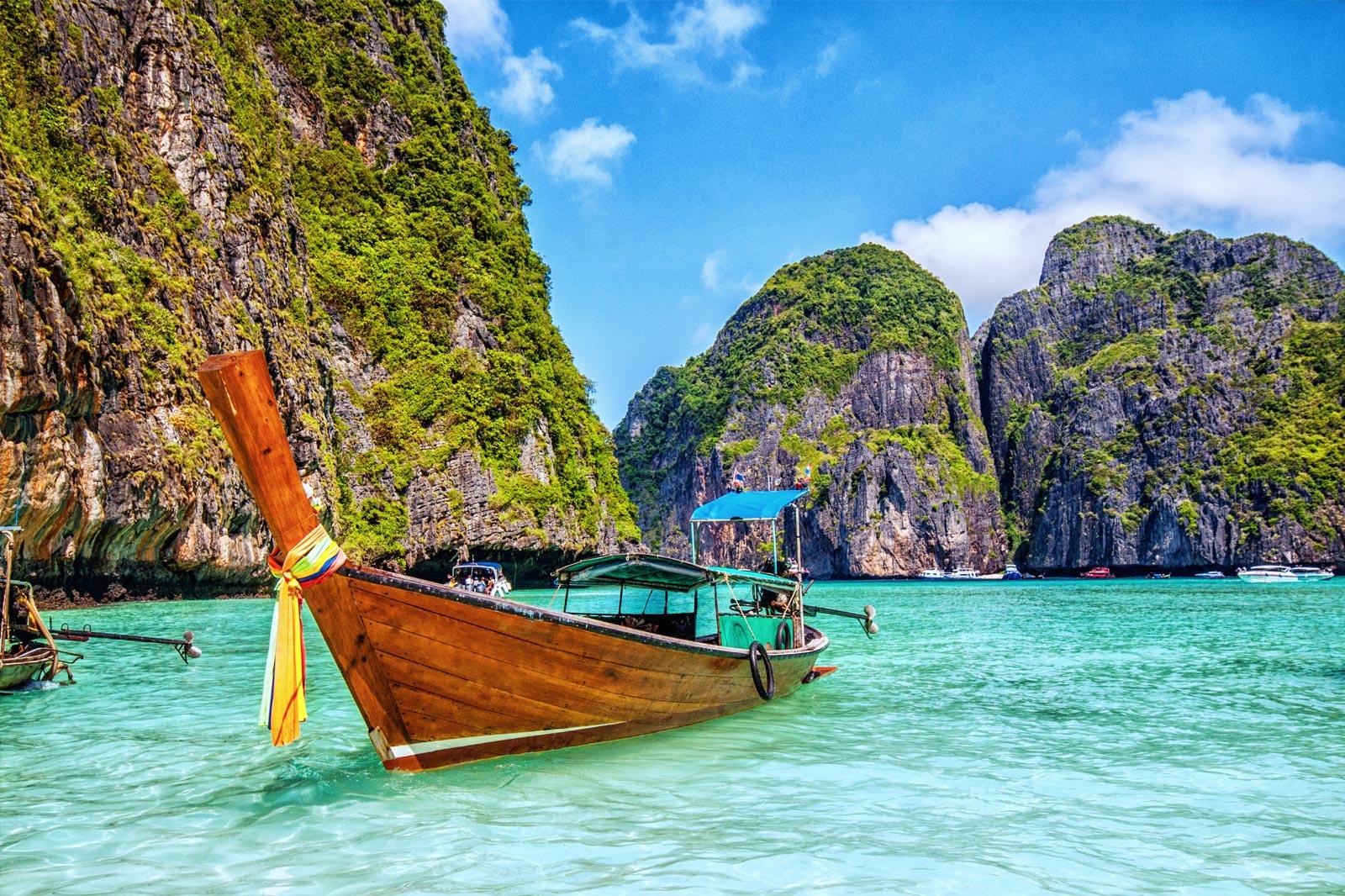 Wooden boat surrounded by islands.