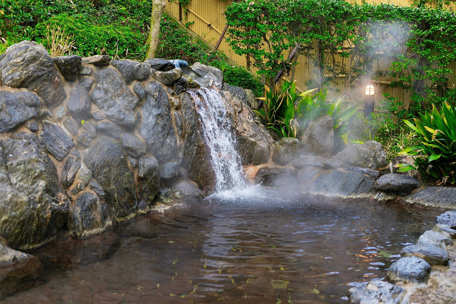 A waterfall in a hot spring bath.