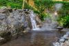 A waterfall in a hot spring bath.