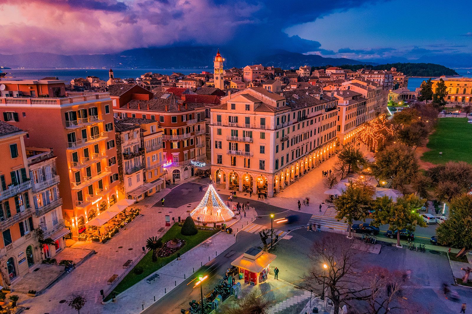 Buildings seen from above lit at night.