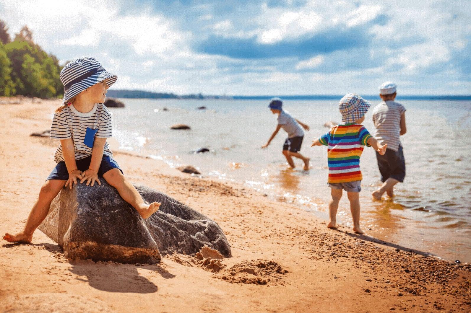 Children playing on the beach and in the ocean.