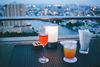 Colorful drinks overlooking the river and city.