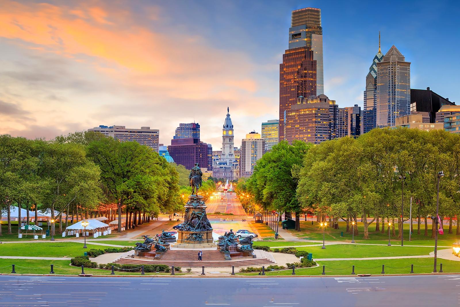 A scenic view of Philadelphia, with the Washington Monument in the foreground.