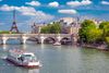 A bridge and a boat over Siene River.