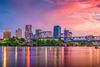 A skyline of a city at sunset.