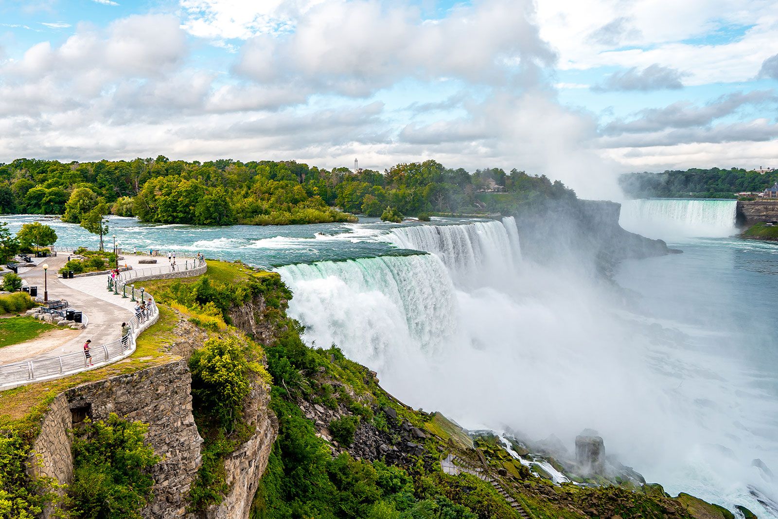 Multiple waterfalls cascade over a cliff. 