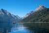 A landscape view of lake and mountains against blue sky.