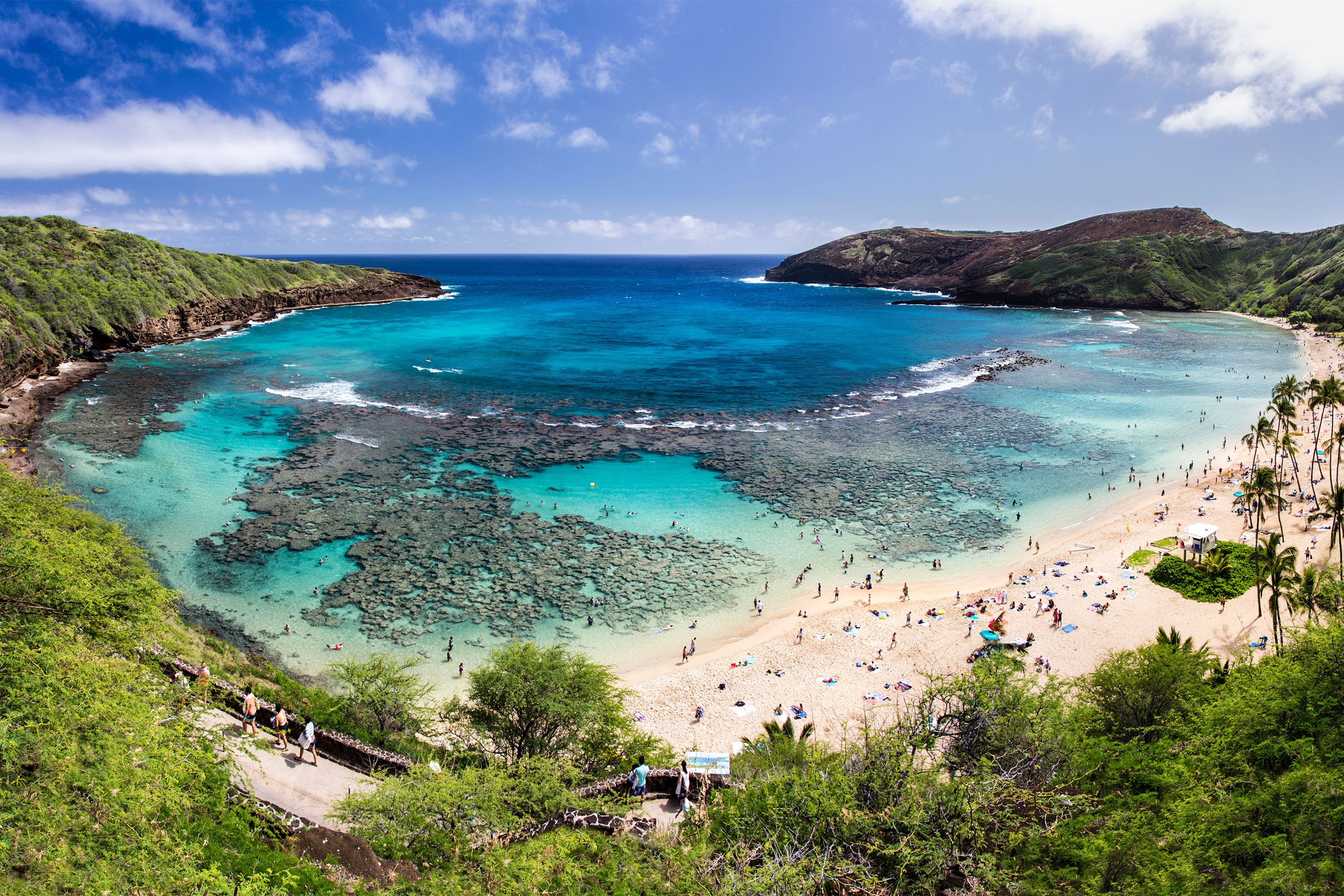 A beach cove with clear blue water.