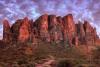 Superstition Mountains at sunset with a colorful sky.