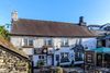 photo by <a href="https://commons.wikimedia.org/wiki/File:Hole_in_t%27Wall_public_house,_Bowness-on-Windermere,_England_02.jpg" target="_blank" rel="noreferrer">Michal Klajban</a> (<a href="https://creativecommons.org/licenses/by-sa/4.0/" target="_blank" rel="noreferrer">CC BY-SA 4.0</a>) modified