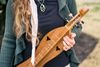 A young woman with a dulcimer.
