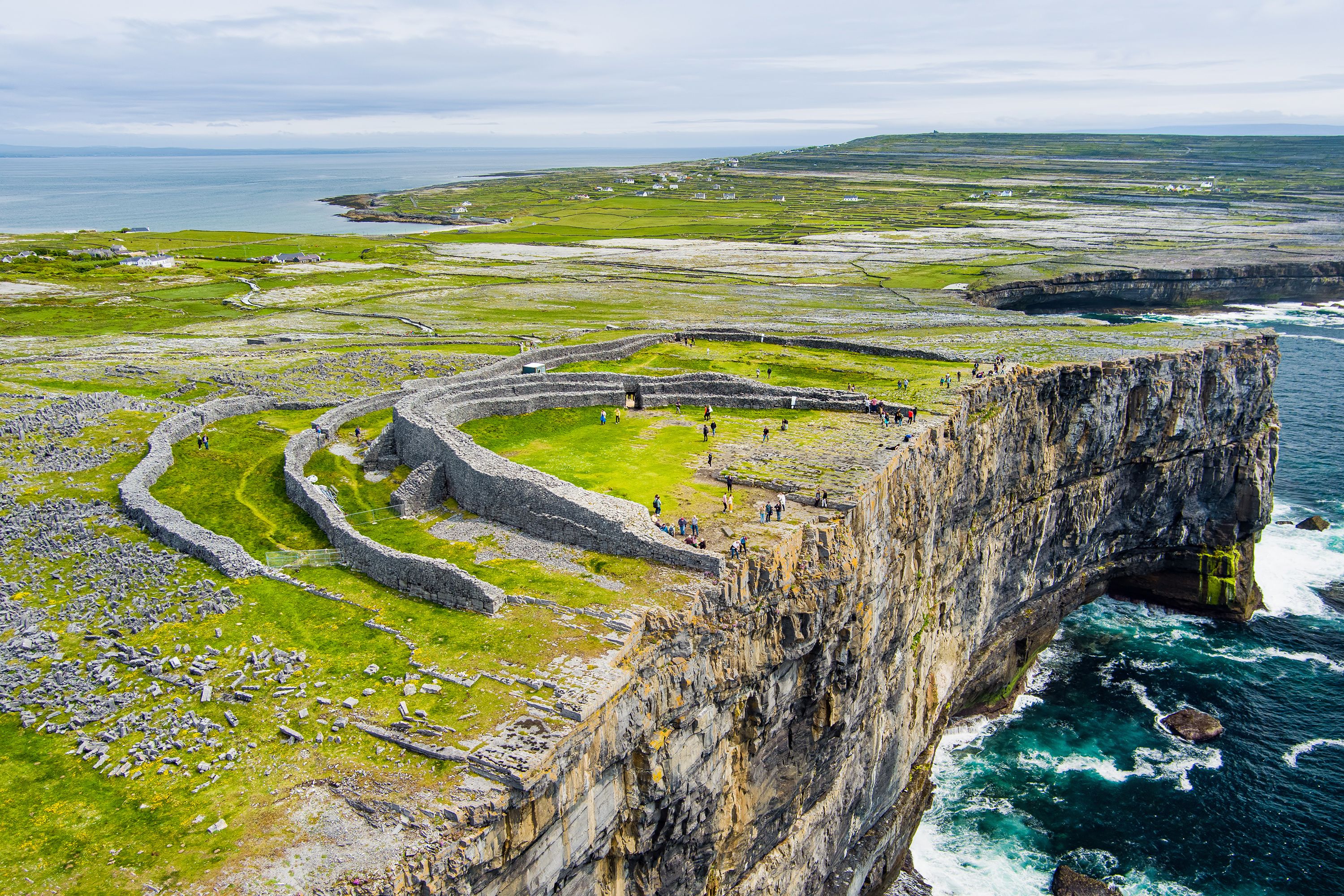 An aerial view of the Dun Aonghasa showcasing the cliffs and the sea in Ireland.