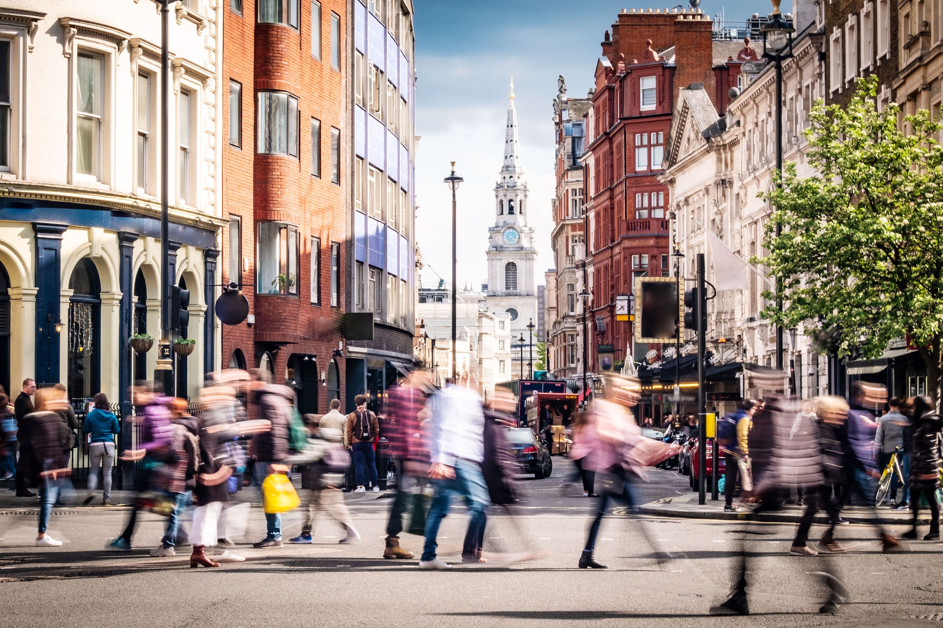 Motion blur of people walking on streets of London, United Kingdom.