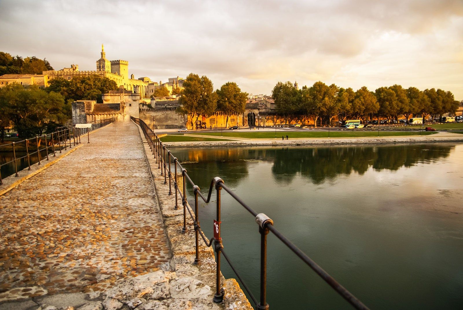 A cobbled bridge leading to park.