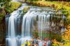 Waterfall flowing over a rocky ledge.