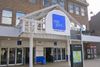 photo by <a href="https://commons.wikimedia.org/wiki/File:Entrance_to_Mill_Gate_shopping_centre,_Bury_(1).JPG" target="_blank" rel="noreferrer">Rept0n1x</a> (<a href="https://creativecommons.org/licenses/by-sa/3.0/" target="_blank" rel="noreferrer">CC BY-SA 3.0</a>)  modified