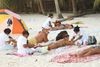 photo by <a href="https://commons.wikimedia.org/wiki/File:Beach_Masseuses_(390626944).jpg" target="_blank" rel="noreferrer">Angelo Juan Ramos</a> (<a href="https://creativecommons.org/licenses/by/2.0/" target="_blank" rel="noreferrer">CC BY 2.0</a>)  modified