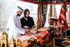 A couple shopping for fine rugs.