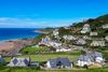 A coastal view of homes along a cliffside.